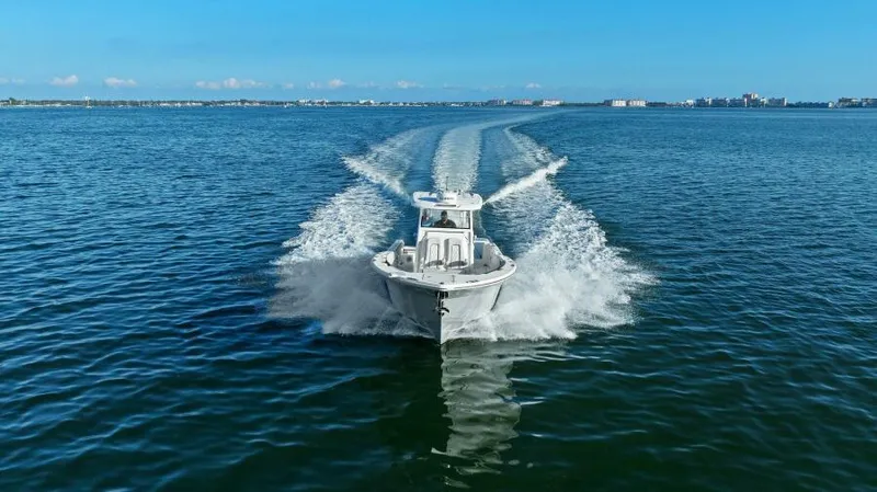 Slide: The Image of 2024 Sea Fox 328 Commander cruising on open water, creating a dynamic wake. - 43