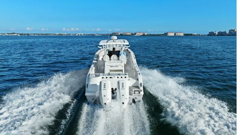 Slide: The Image of 2024 Sea Fox 328 Commander cruising on open water, rear view. - 44