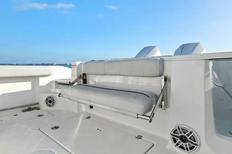 Slide: The Image of 2024 Sea Fox 328 Commander boat interior with cushioned seating and ocean view. - 8