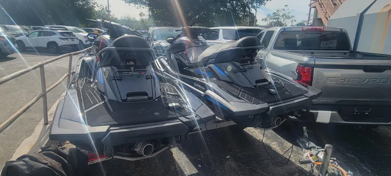 Slide: The Image of Two 2020 Yamaha WaveRunner FX Cruiser SVHO jet skis parked in a lot. - 3