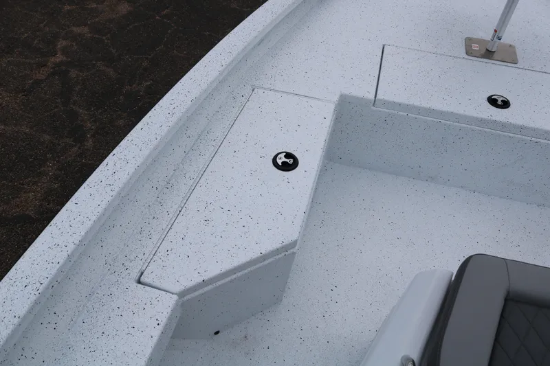 Slide: The Image of 2025 Xpress H20B boat deck with storage compartments and seating. - 10