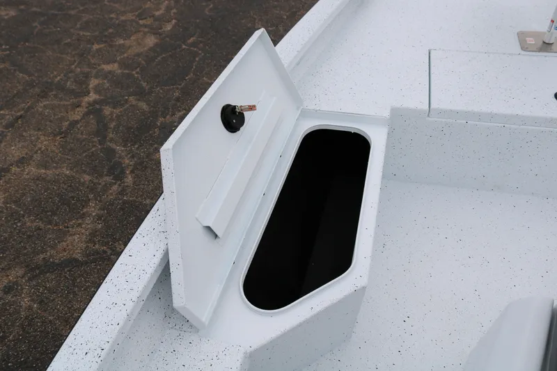 Slide: The Image of 2025 Xpress H20B boat storage compartment with open hatch, showcasing interior space. - 11