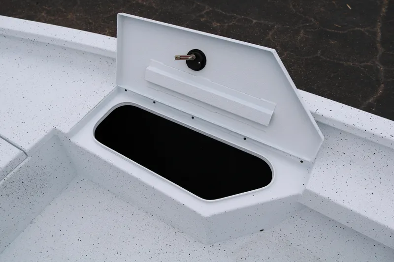Slide: The Image of Open storage compartment on 2025 Xpress H20B boat deck. - 16