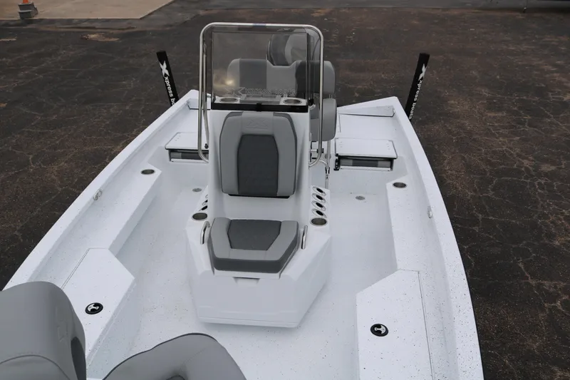 Slide: The Image of 2025 Xpress H20B boat interior with seating and console, viewed from above. - 18