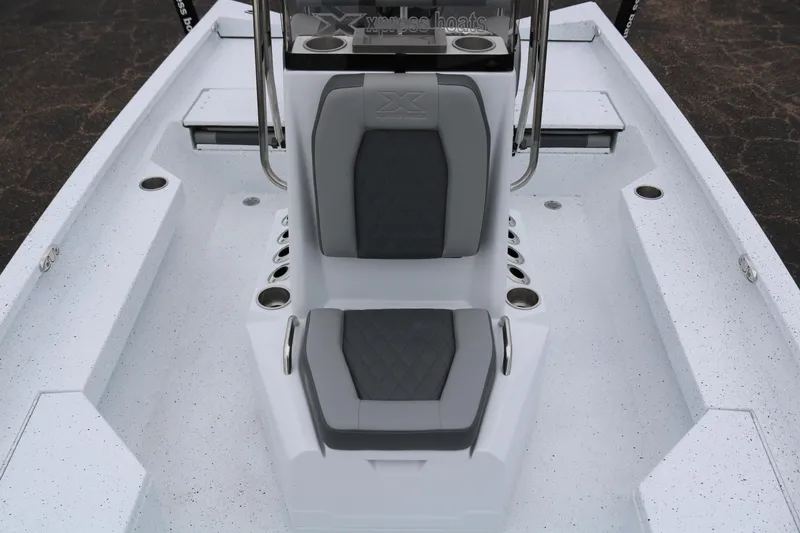 Slide: The Image of 2025 Xpress H20B boat interior with gray seating and cup holders. - 19