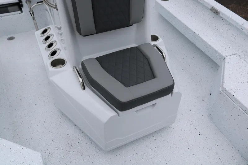 Slide: The Image of 2025 Xpress H20B boat seat with cup holders and gray cushion. - 22