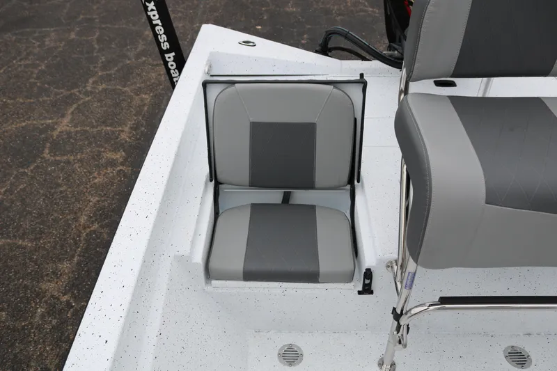 Slide: The Image of 2025 Xpress H20B boat seat with gray and black upholstery. - 26