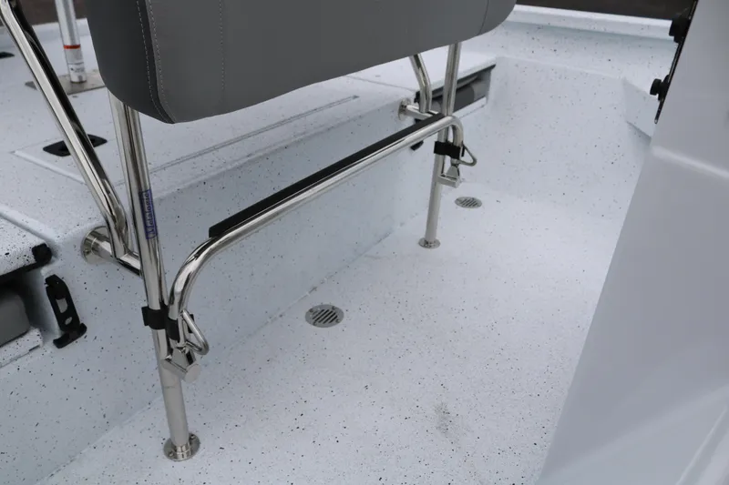 Slide: The Image of 2025 Xpress H20B boat interior with gray seating and stainless steel fixtures. - 31
