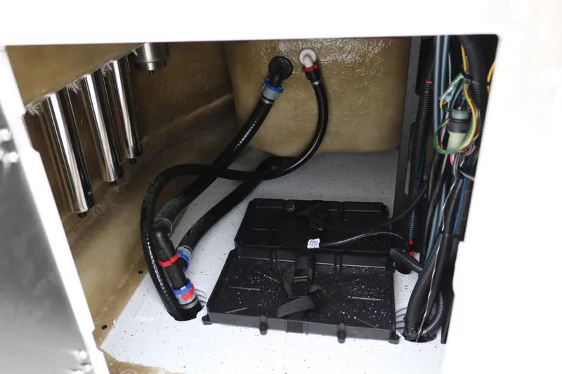 Slide: The Image of 2025 Xpress H20B boat compartment with wiring and battery setup. - 35