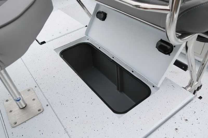 Slide: The Image of 2025 Xpress H20B boat storage compartment with open lid, showcasing interior space. - 37