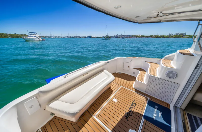 Slide: The Image of 2003 Sea Ray 400 Sedan Bridge yacht with spacious deck and scenic ocean view. - 10