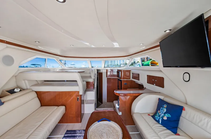 Slide: The Image of Luxurious interior of 2003 Sea Ray 400 Sedan Bridge yacht with elegant seating and modern amenities. - 11