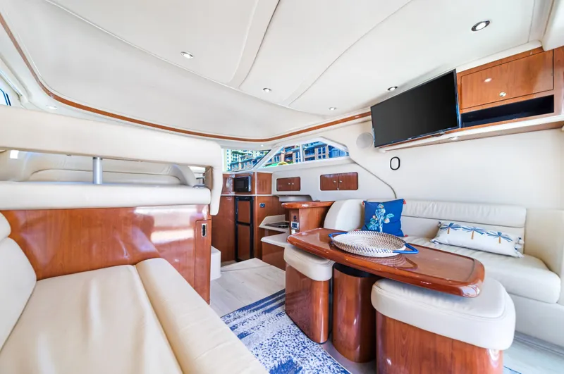 Slide: The Image of Luxurious interior of 2003 Sea Ray 400 Sedan Bridge yacht with elegant seating and modern amenities. - 12