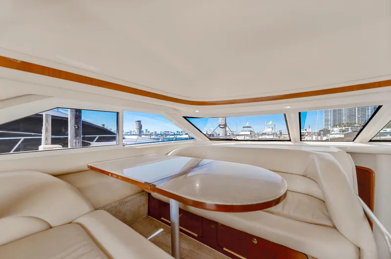Slide: The Image of Interior of 2003 Sea Ray 400 Sedan Bridge yacht with city skyline view. - 15