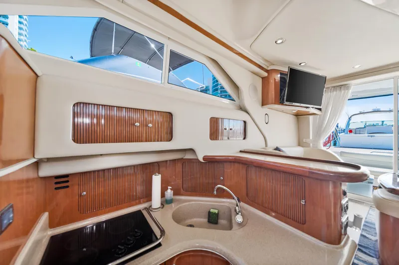 Slide: The Image of Interior of 2003 Sea Ray 400 Sedan Bridge yacht kitchen area. - 17