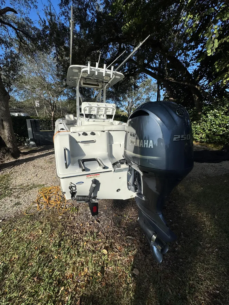 Slide: The Image of 2015 Sea Hunt Ultra 234 boat with Yamaha 250 engine, parked outdoors. - 4