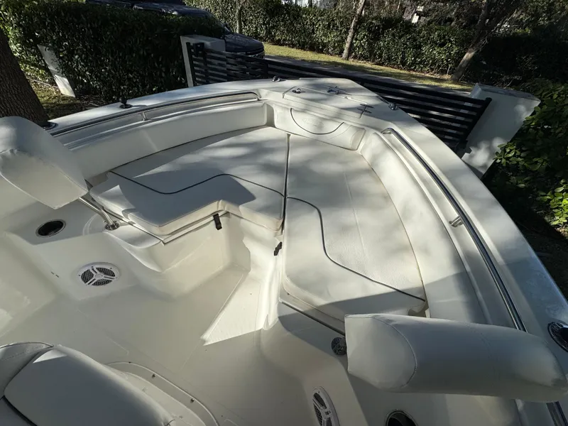 Slide: The Image of 2015 Sea Hunt Ultra 234 boat interior with seating and speakers. - 8