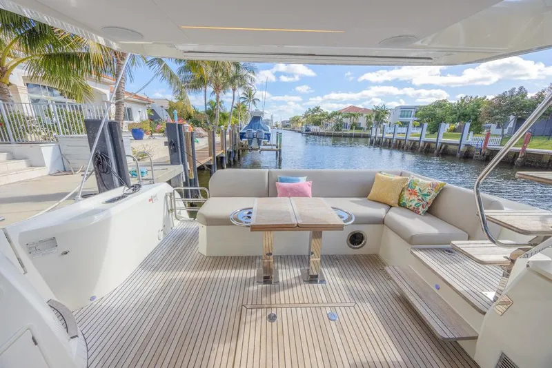Slide: The Image of Luxurious 2021 Prestige 520 Flybridge yacht with spacious deck and canal view. - 18