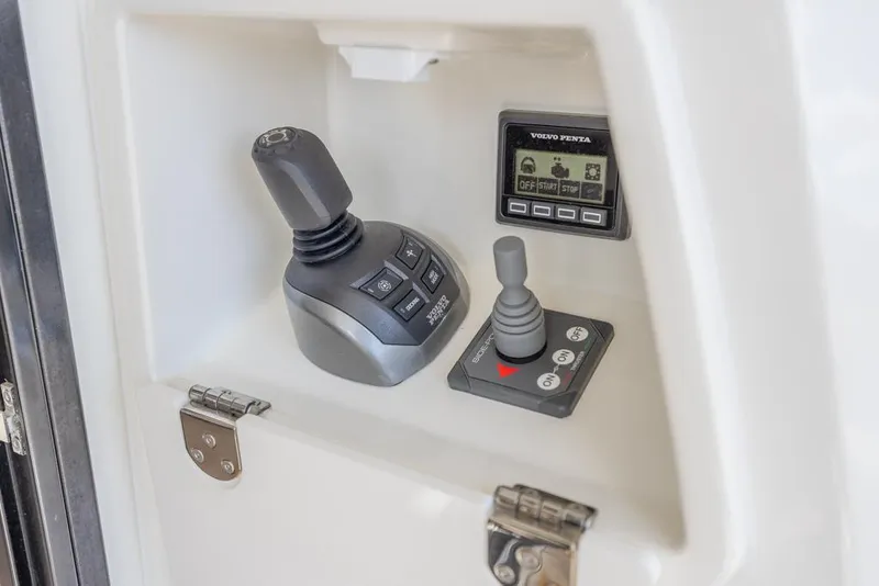 Slide: The Image of Control panel of 2021 Prestige 520 Flybridge yacht with joystick and display. - 30