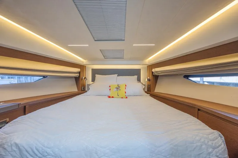 Slide: The Image of Luxurious bedroom interior of 2021 Prestige 520 Flybridge yacht with modern lighting. - 45