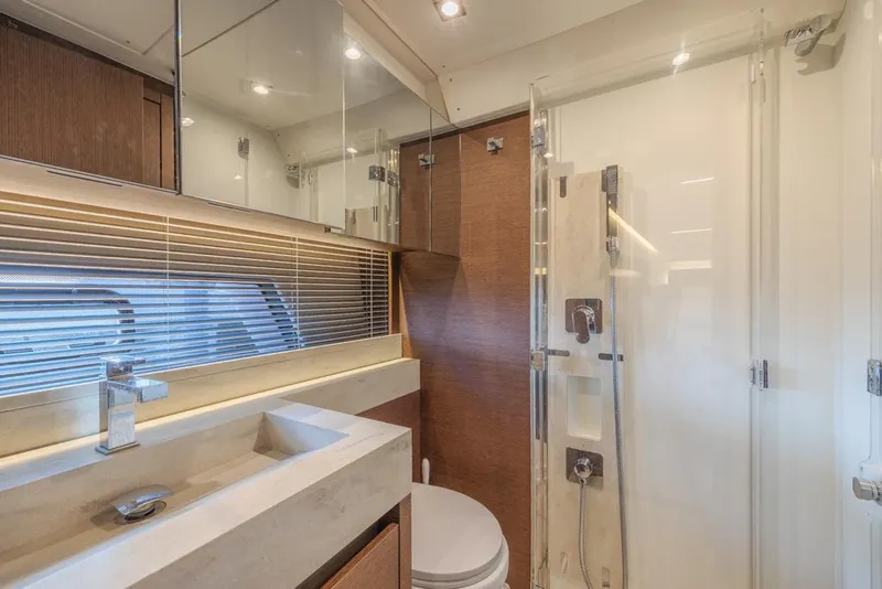 Slide: The Image of Luxurious bathroom in 2021 Prestige 520 Flybridge yacht with modern fixtures and glass shower. - 46