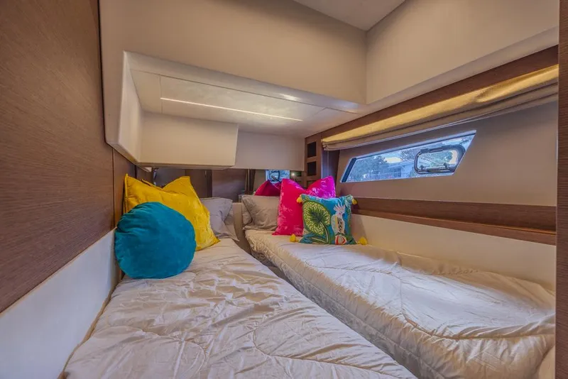 Slide: The Image of Luxurious 2021 Prestige 520 Flybridge cabin with colorful pillows and modern design. - 47