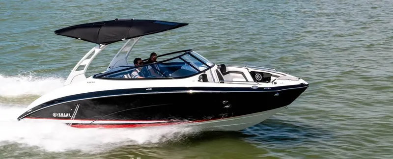 Slide: The Image of 2020 Yamaha Boats 242 Limited SE cruising on water. - 16