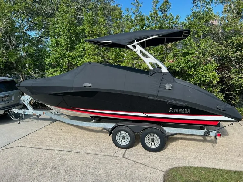 Slide: The Image of 2020 Yamaha Boats 242 Limited SE on trailer, covered, parked outdoors. - 20