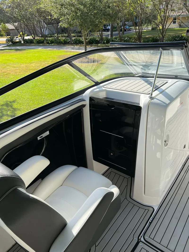 Slide: The Image of 2020 Yamaha Boats 242 Limited SE interior with sleek seating and modern dashboard. - 8