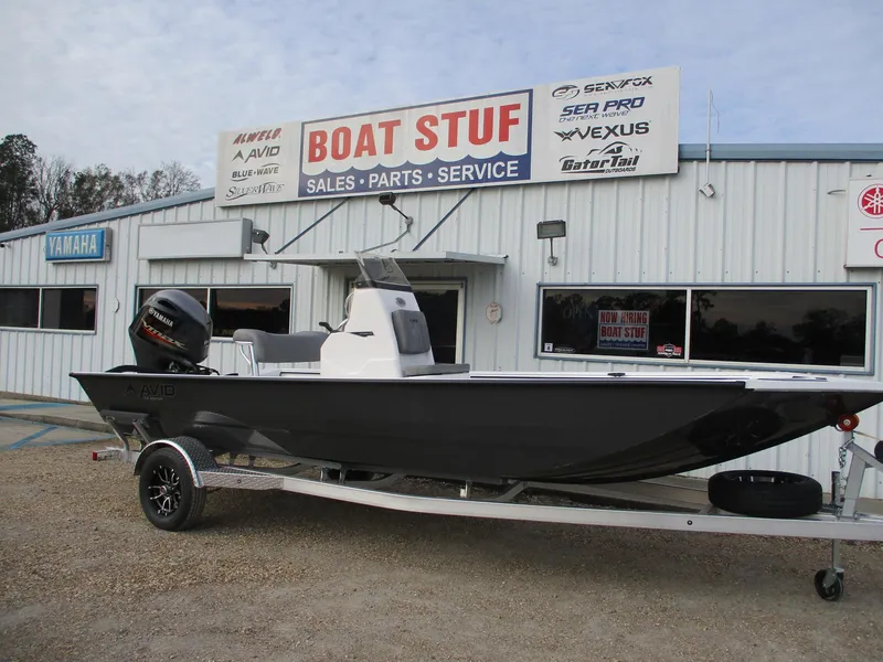 Slide: The Image of 2025 Avid 20 ROGUE CC boat on trailer outside dealership. - 0