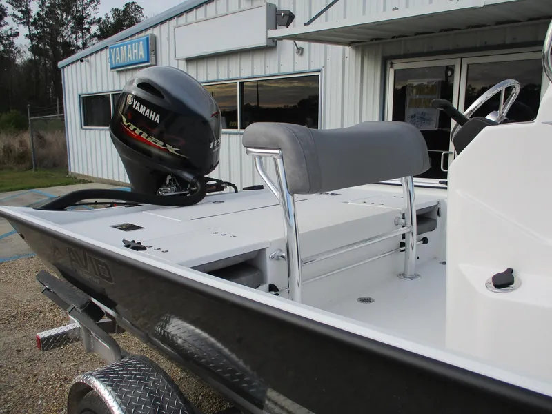 Slide: The Image of 2025 Avid 20 ROGUE CC boat with Yamaha motor, parked outside dealership. - 4
