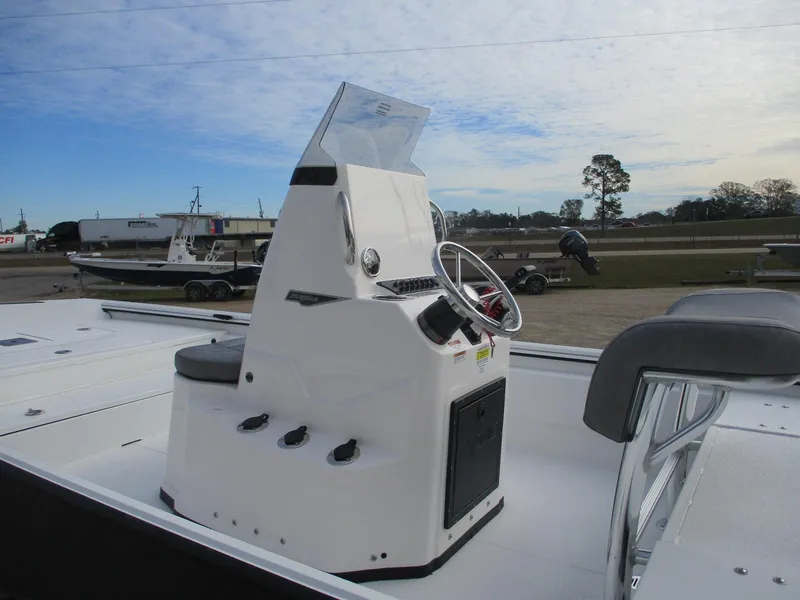 Slide: The Image of Avid 20 ROGUE CC 2025 boat console with steering wheel and controls. - 8