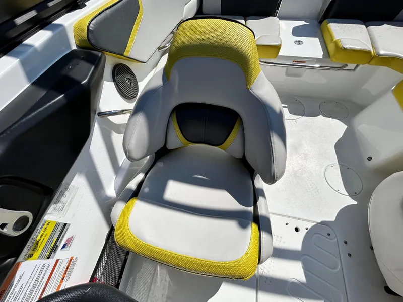 Slide: The Image of 2024 Scarab 195 ID boat interior with yellow and white seating. - 10