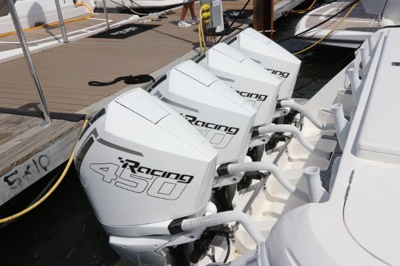 Slide: The Image of 2019 Intrepid 475 Sport Yacht with four Racing 450 outboard engines at dock. - 2