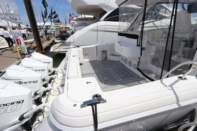 Slide: The Image of 2019 Intrepid 475 Sport Yacht docked with powerful outboard engines. - 20