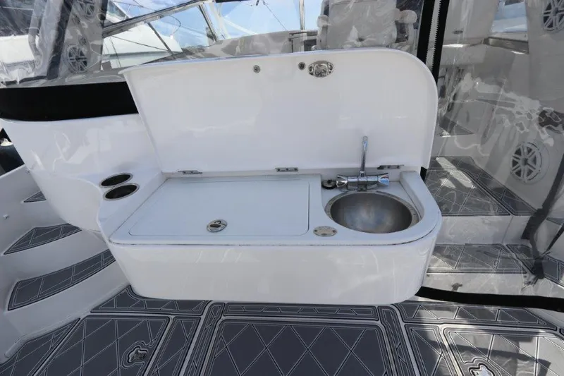 Slide: The Image of 2019 Intrepid 475 Sport Yacht sink and counter area with modern design. - 24