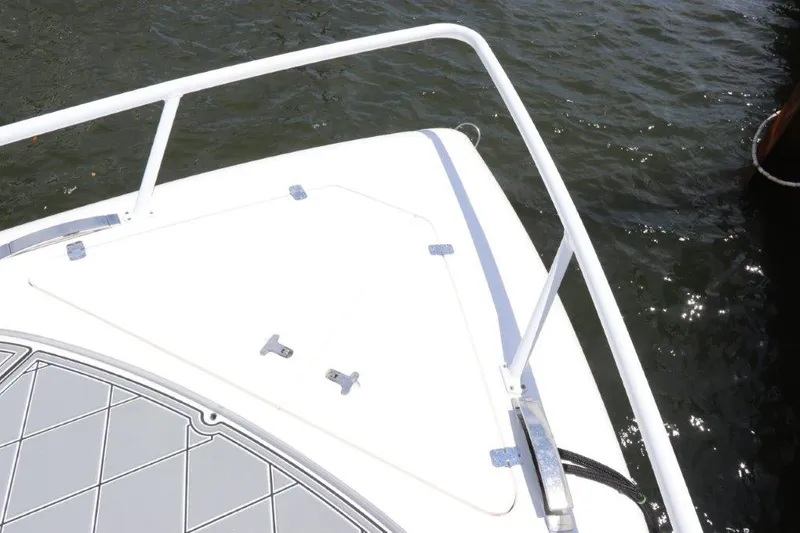 Slide: The Image of 2019 Intrepid 475 Sport Yacht bow with railing on water. - 25