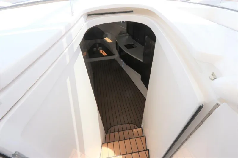 Slide: The Image of 2019 Intrepid 475 Sport Yacht interior with sleek design and wooden flooring. - 41