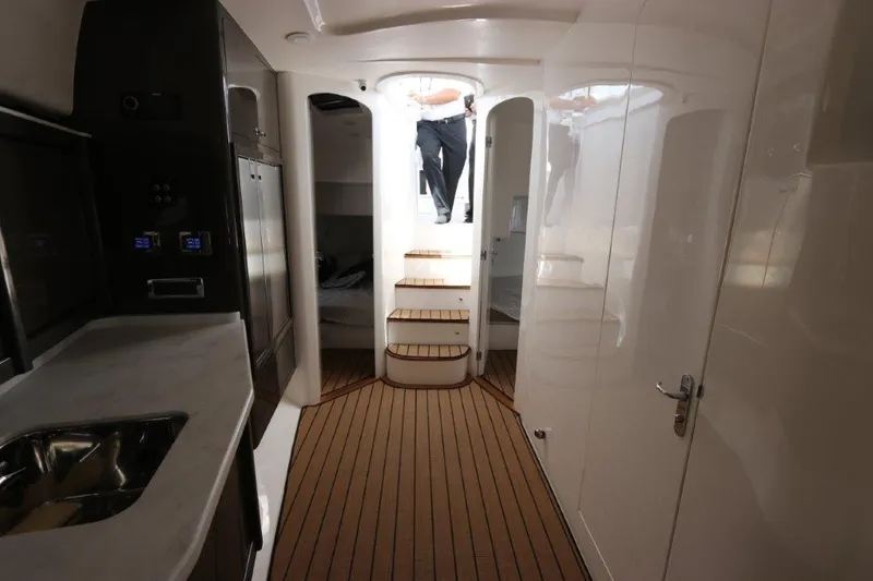 Slide: The Image of Interior of 2019 Intrepid 475 Sport Yacht with modern design and wooden flooring. - 42