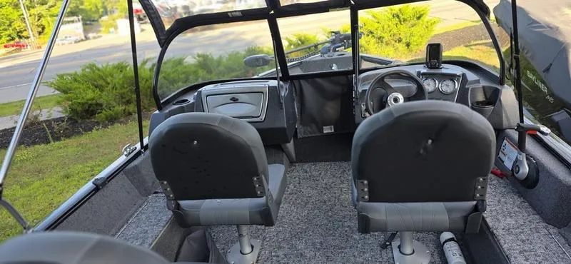 Slide: The Image of Interior of 2025 Tracker PG V16 WT boat with two seats and steering console. - 4