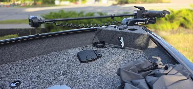 Slide: The Image of 2025 Tracker PG V16 WT boat with Minn Kota trolling motor on deck. - 6