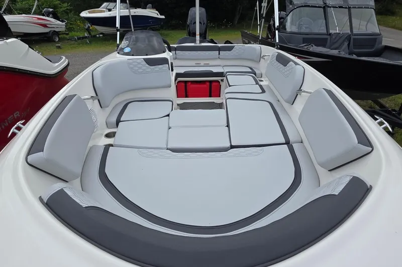 Slide: The Image of 2025 Bayliner M15 boat interior with spacious seating and modern design. - 16