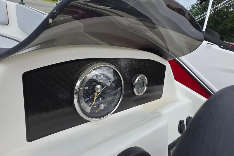 Slide: The Image of Dashboard of 2025 Bayliner M15 boat with speedometer and digital display. - 7