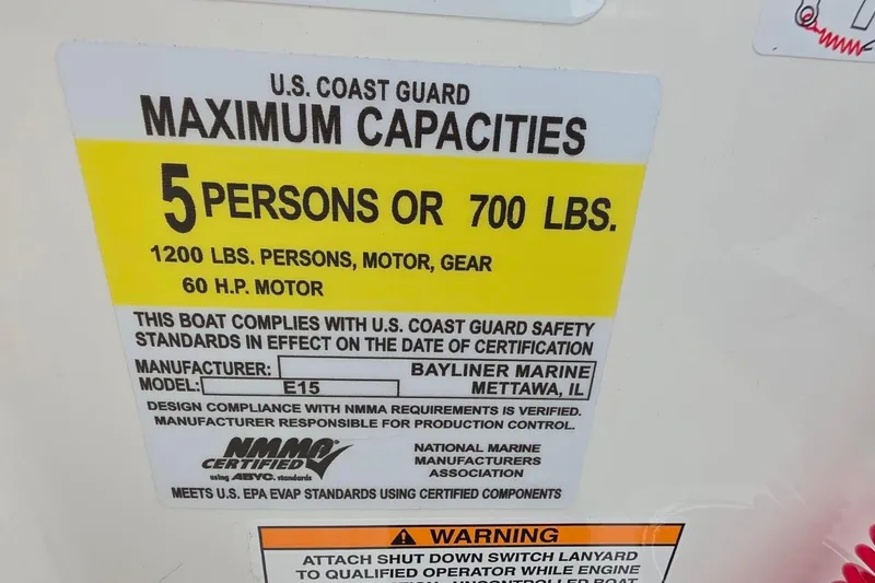 Slide: The Image of U.S. Coast Guard capacity label for Bayliner M15, 2025 model, 5 persons or 700 lbs. - 8