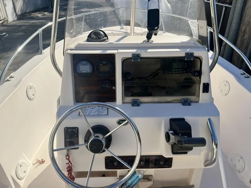 Slide: The Image of 1998 Grady-White 180 Sportsman boat dashboard with steering wheel and controls. - 11