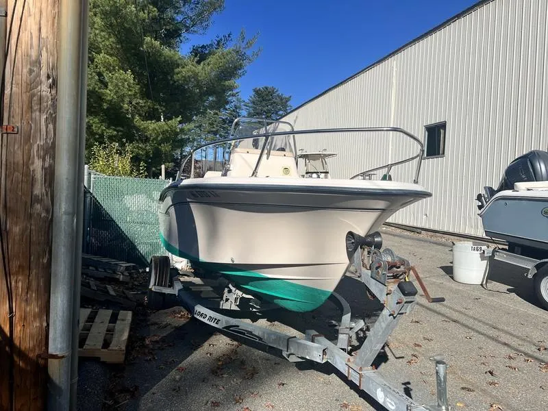 Slide: The Image of 1998 Grady-White 180 Sportsman boat on trailer, parked outdoors near a building. - 4