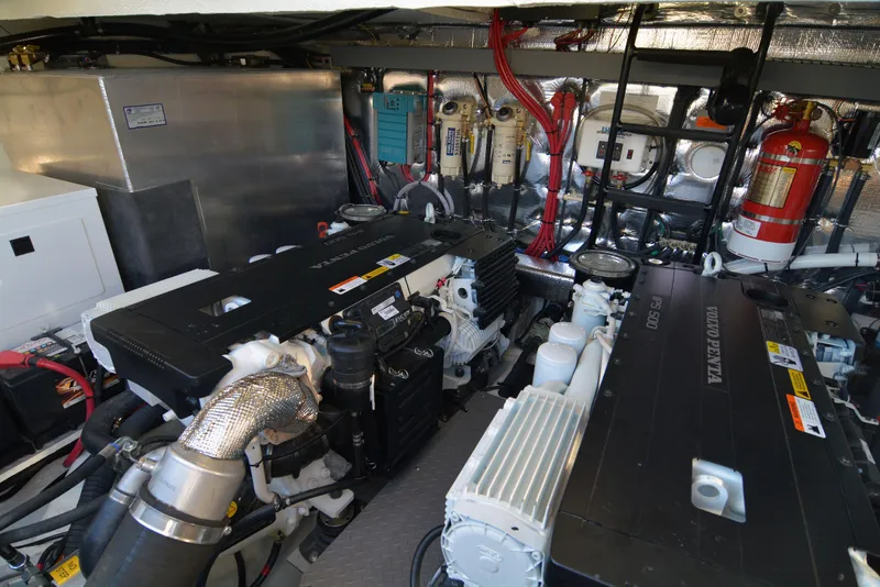 Slide: The Image of Engine room of 2018 Regal 46 Sport Coupe with modern equipment and wiring. - 28