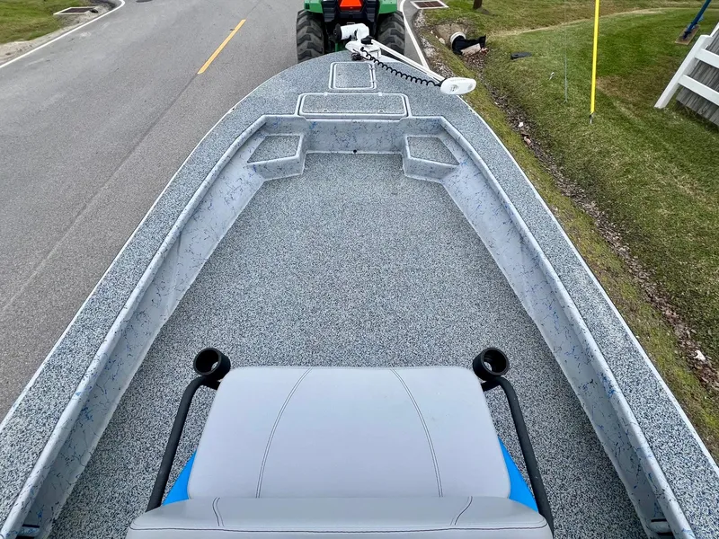 Slide: The Image of 2021 Haynie 25 Magnum boat on trailer, viewed from above on a road. - 12