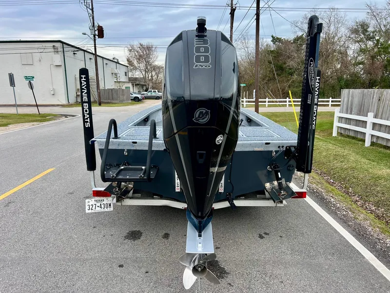 Slide: The Image of 2021 Haynie 25 Magnum boat with powerful outboard motor on a trailer. - 3