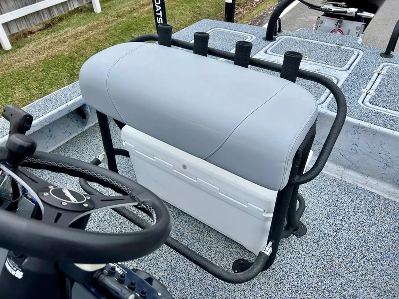 Slide: The Image of 2021 Haynie 25 Magnum boat interior with steering wheel and seating. - 9